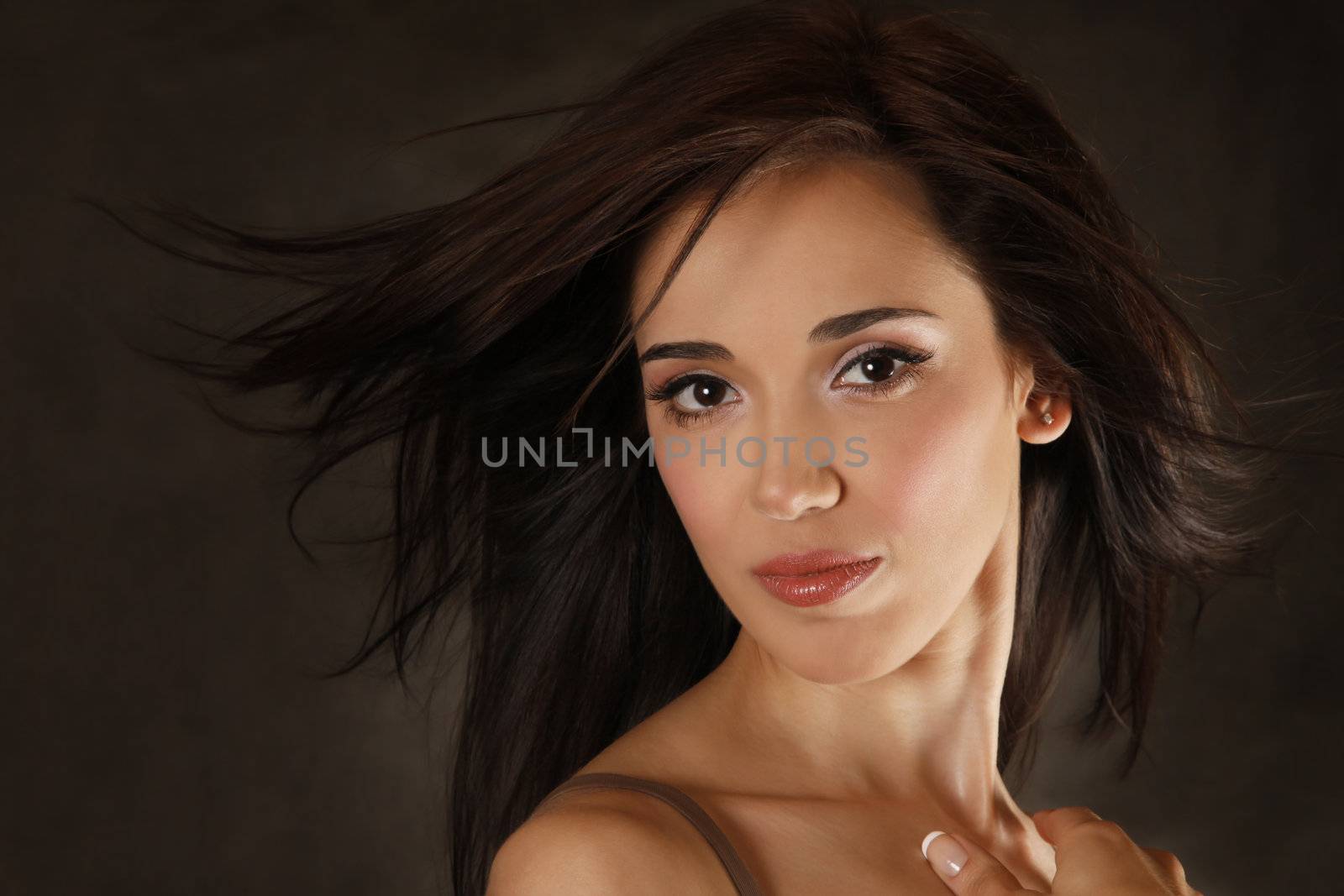 Portrait of the beautiful brunette in studio