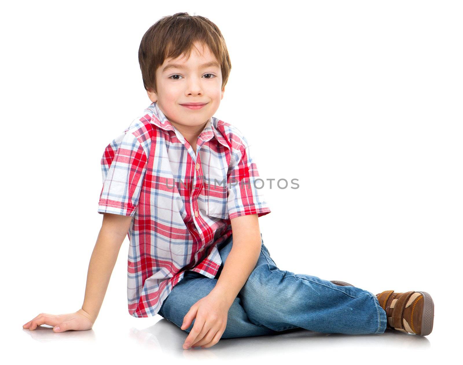 cute boy on the white floor