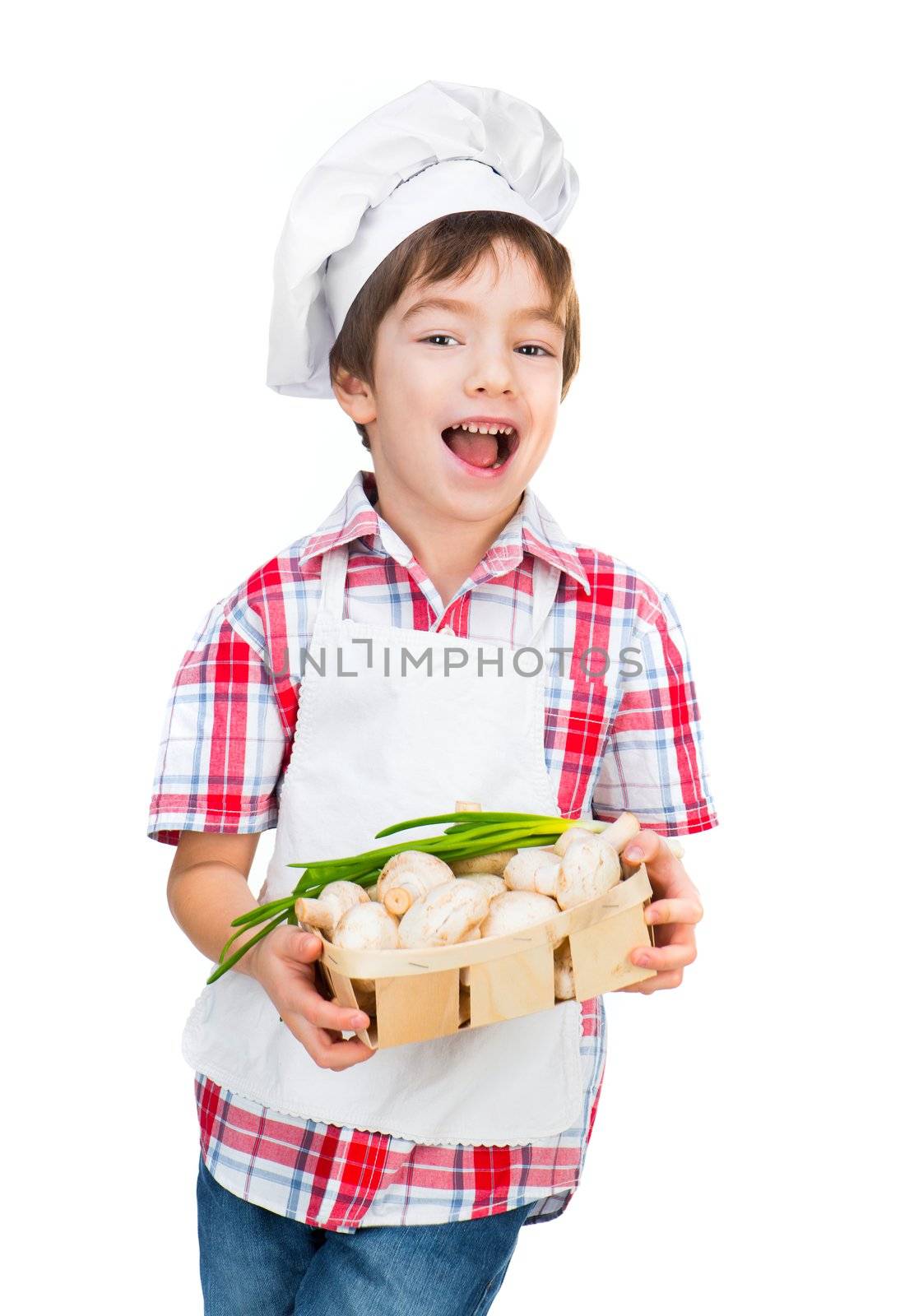 ittle boy with mushrooms isolated on a white background