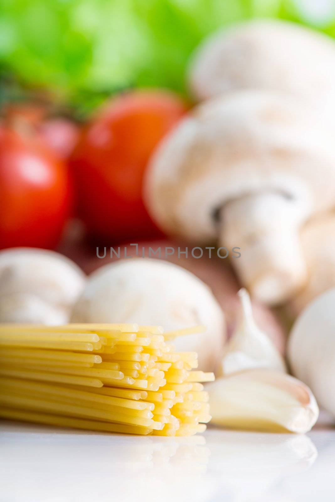 Tasty colorful vegetables with raw pasta