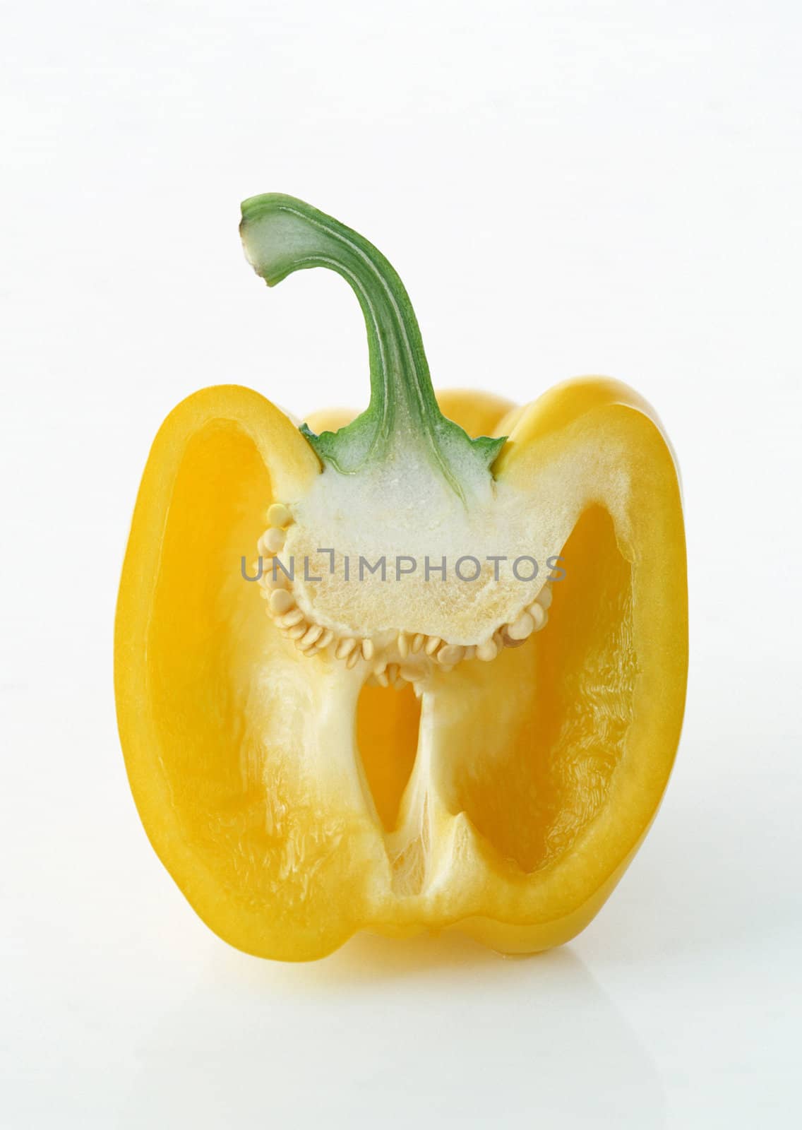 fresh yellow paprika half isolated on white background