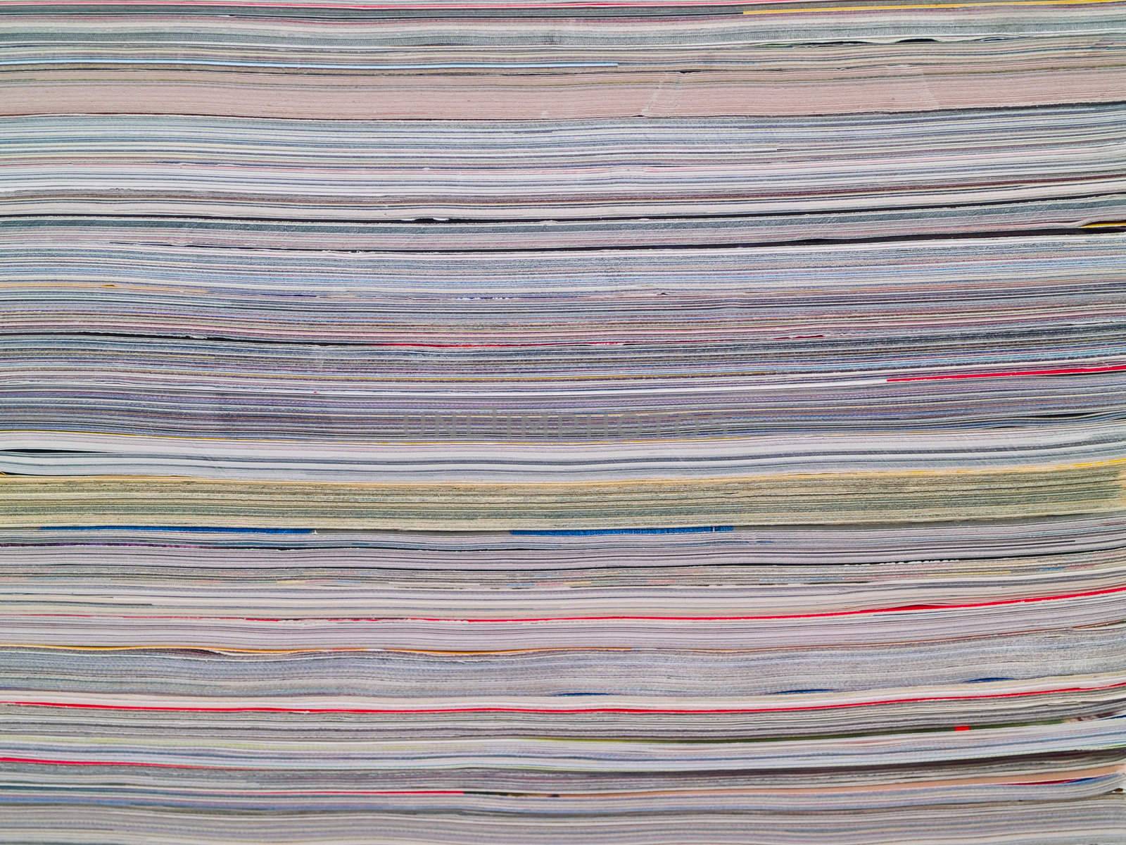 A stack of magazines filling the frame from top to bottom