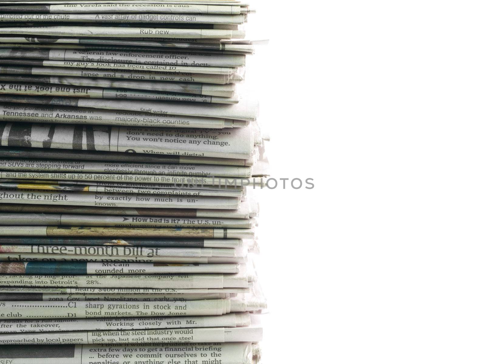 Old newspapers stacked from the top to bottom of the frame isolated on white