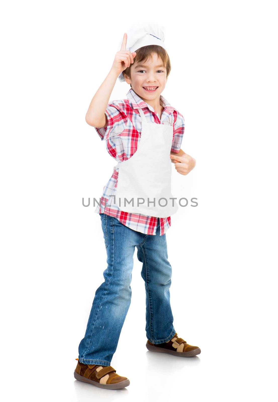smiling boy dressed as a cook shows up isolated on a white background