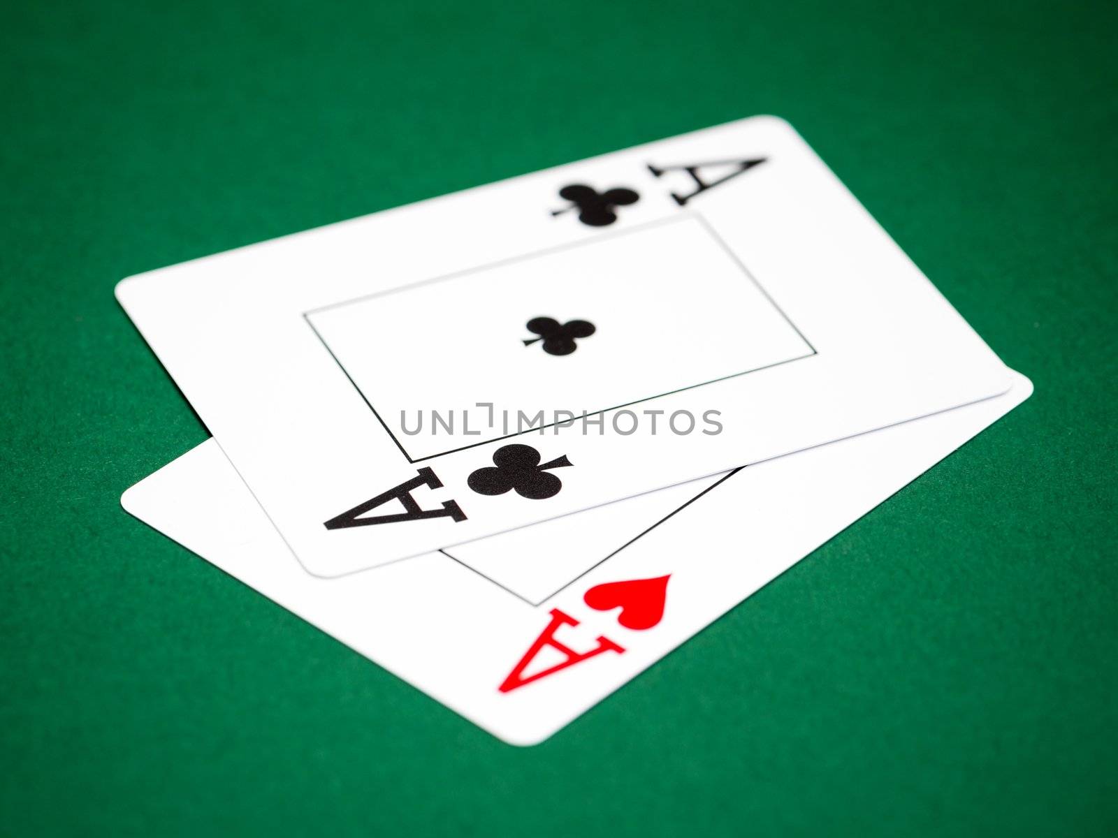 playing cards on a green table casino