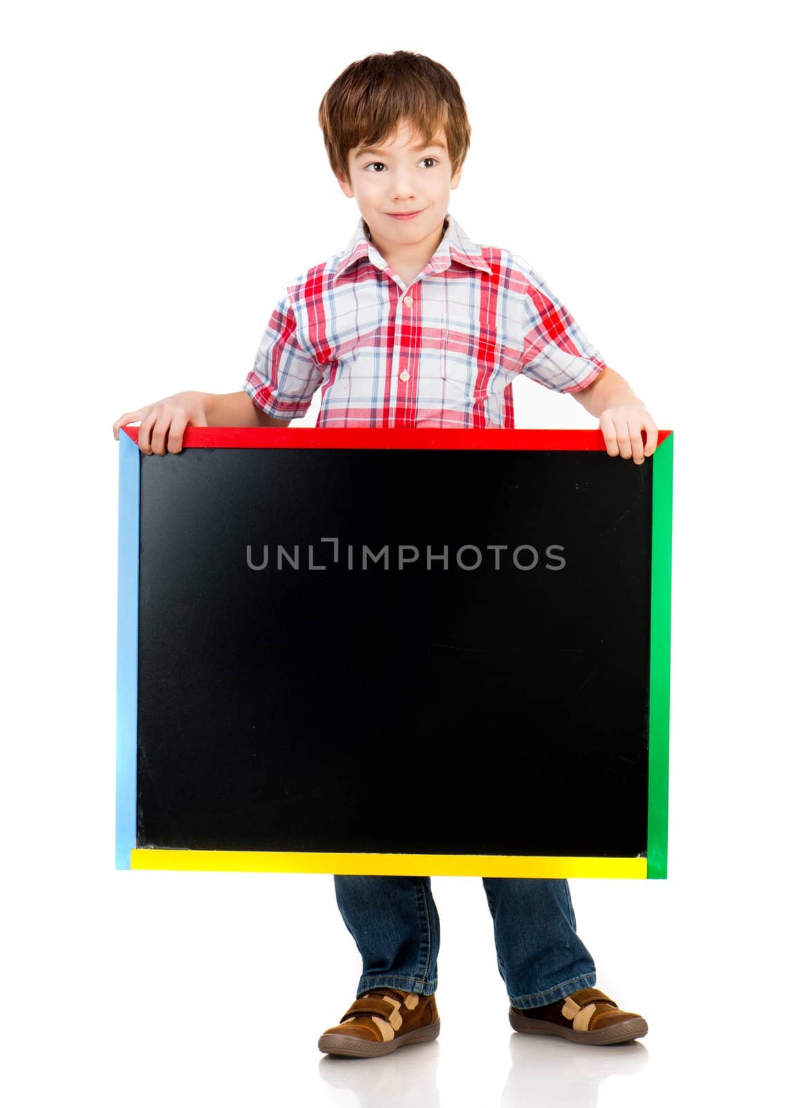 Cute boy holding a blackboard over white background