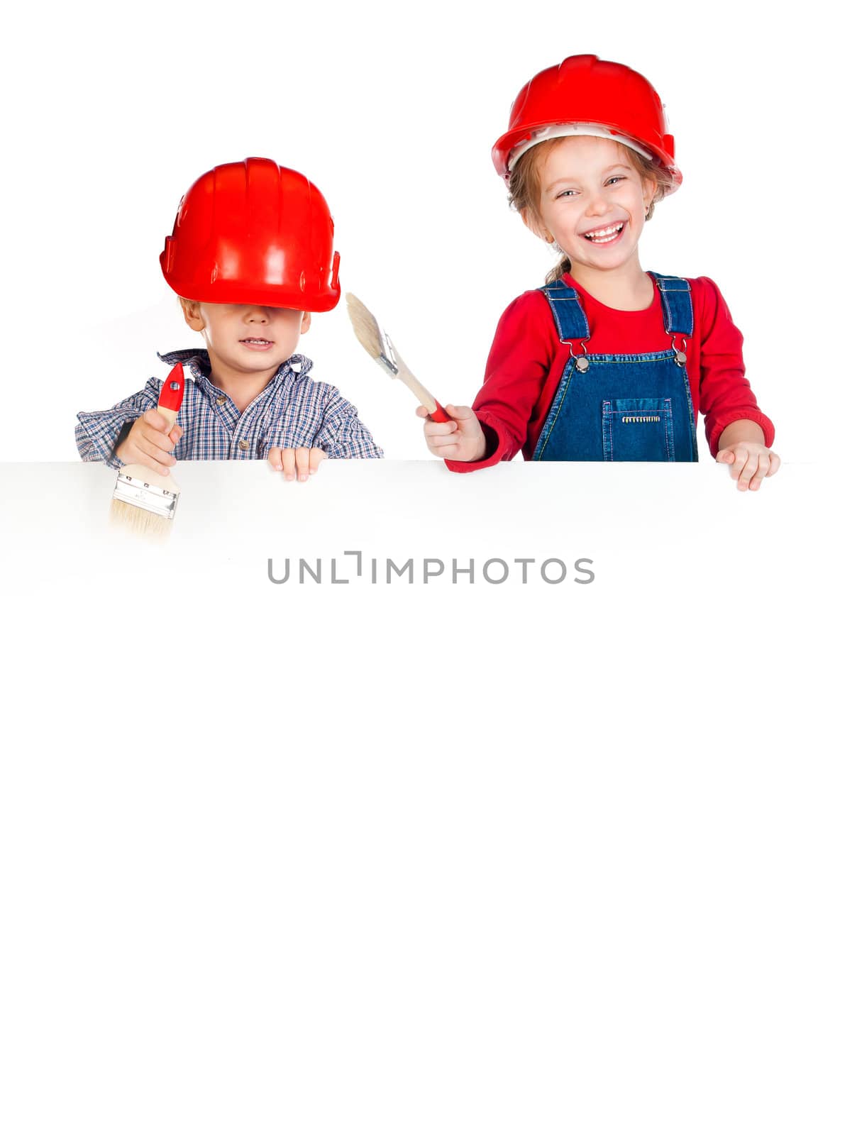 Pretty little girl and boy in halmet with white banner