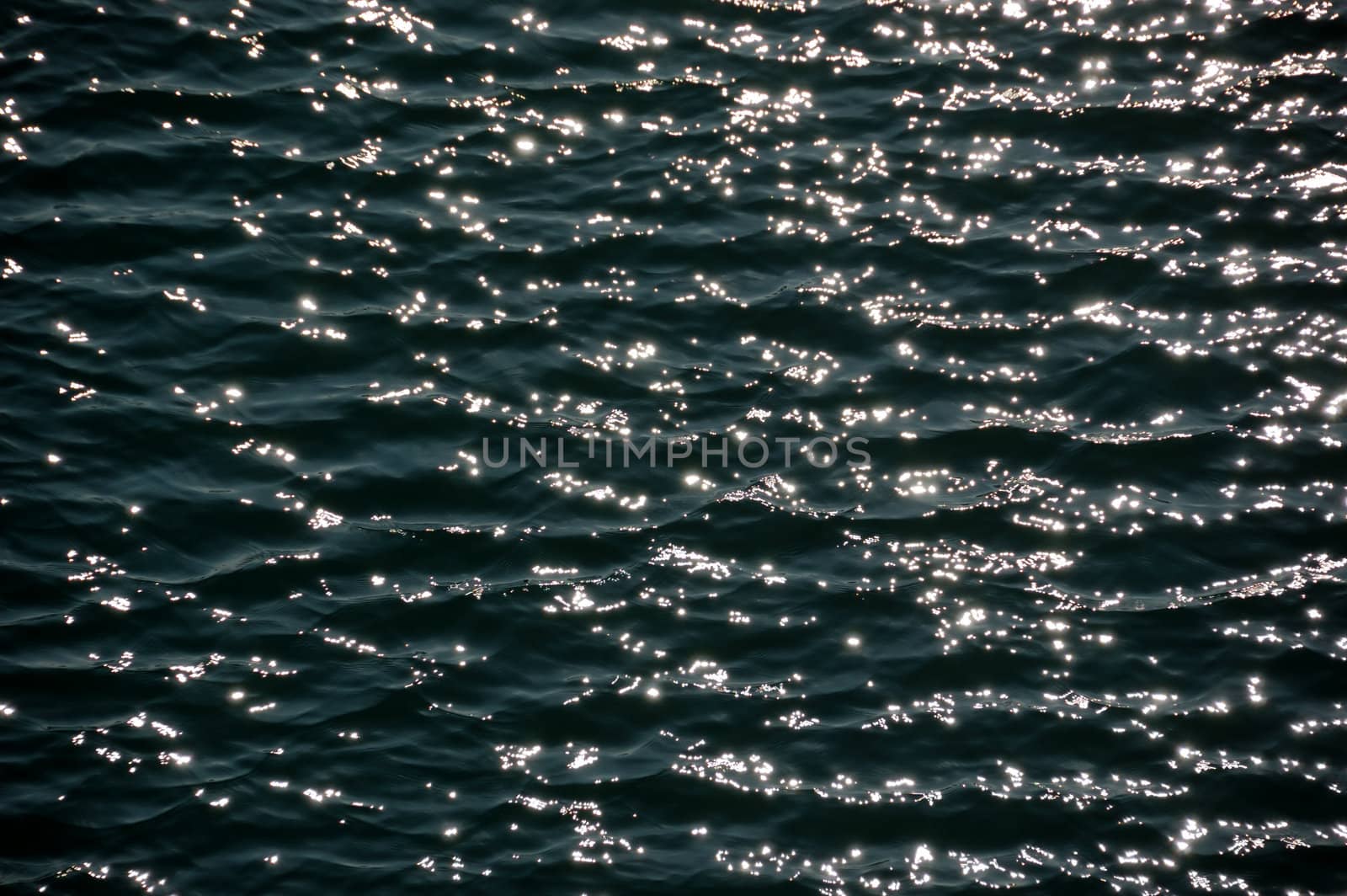 Light reflections on sea water. Abstract background.