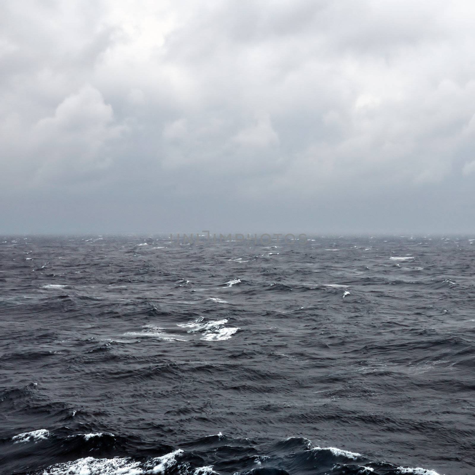 Restless deep sea water and overcast sky.