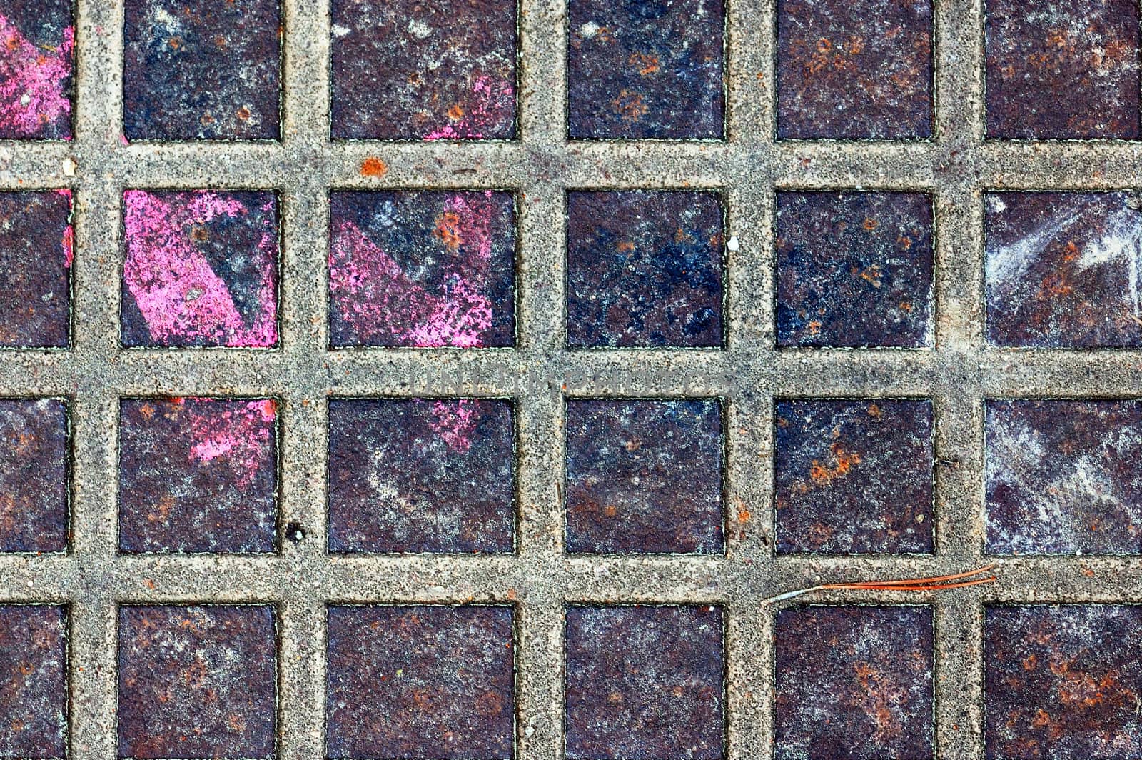 Rusty metal squares stained surface. Industrial background texture.