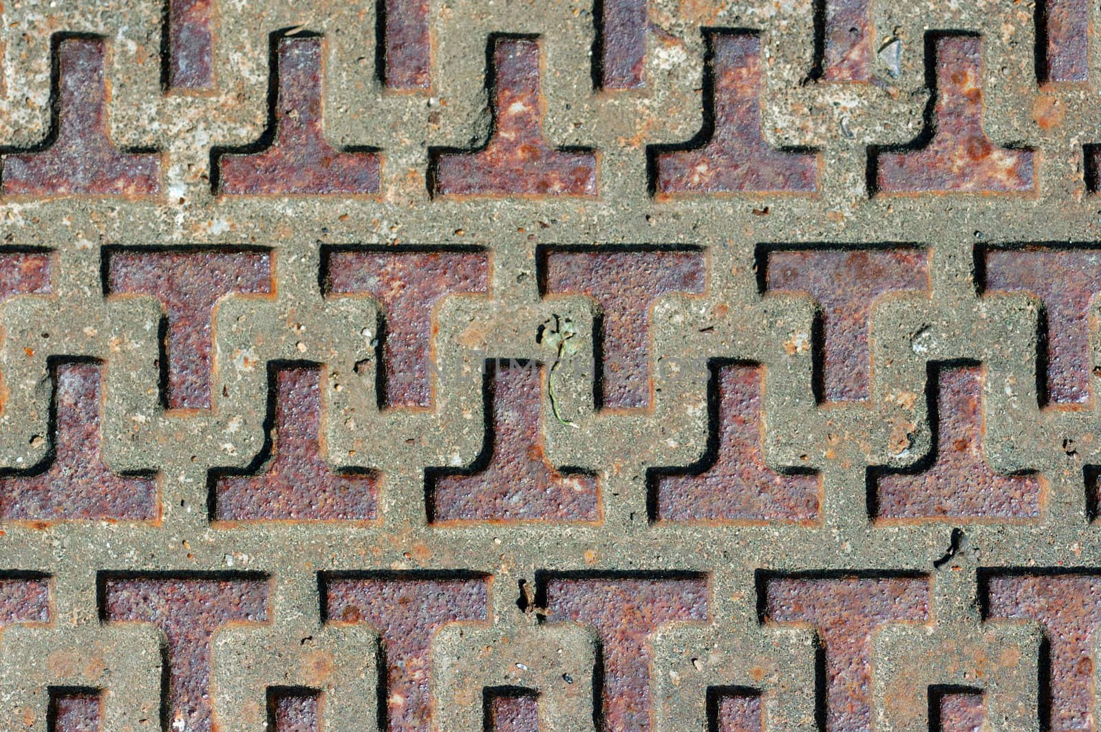 Rusty industrial metal surface with abstract pattern.