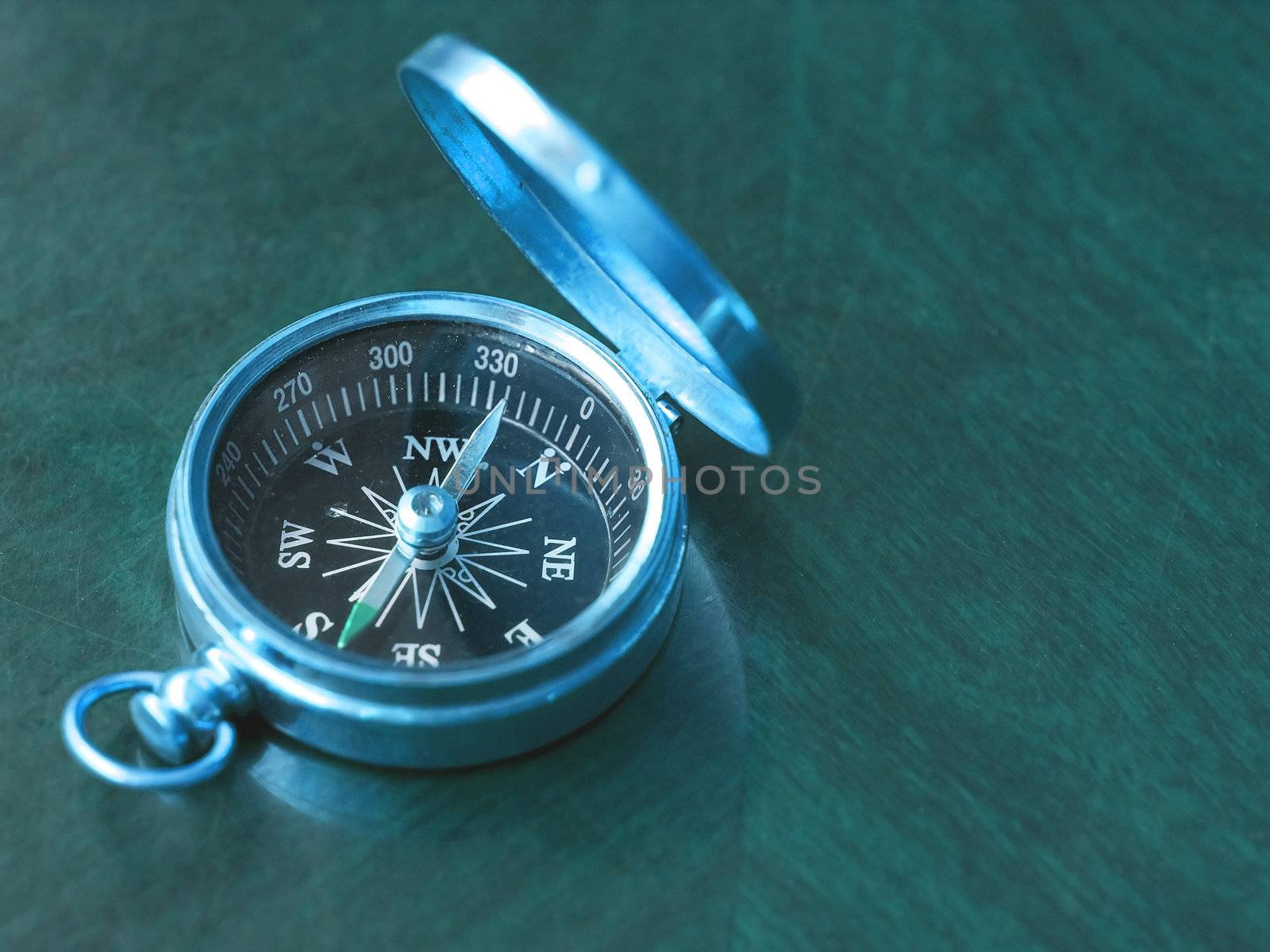 Brass Compass on an old cherrywood table