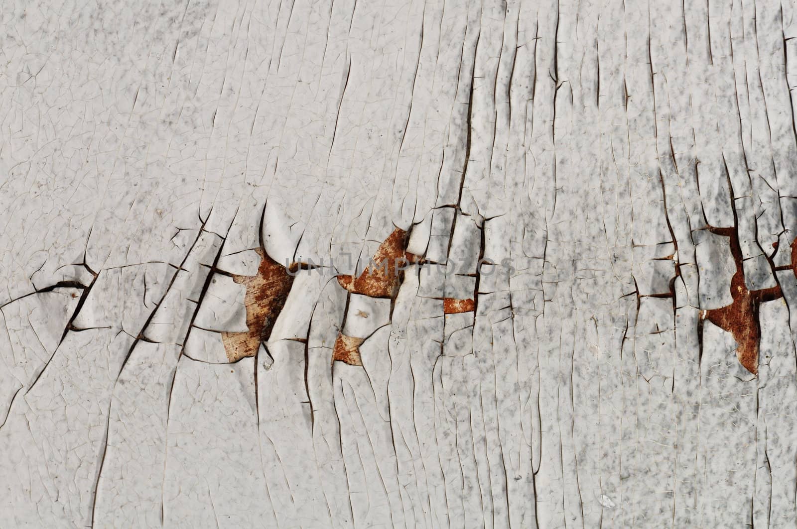 White cracked peeling paint grungy background texture.