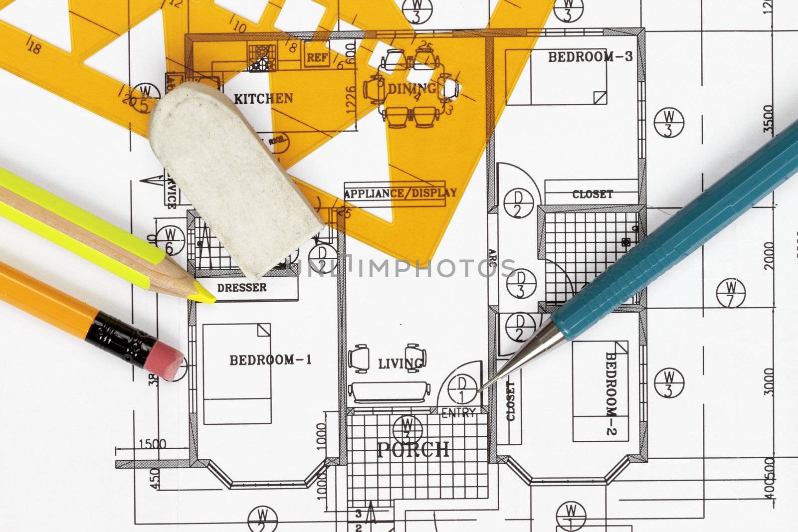 House plan blueprints close up with pencil and template