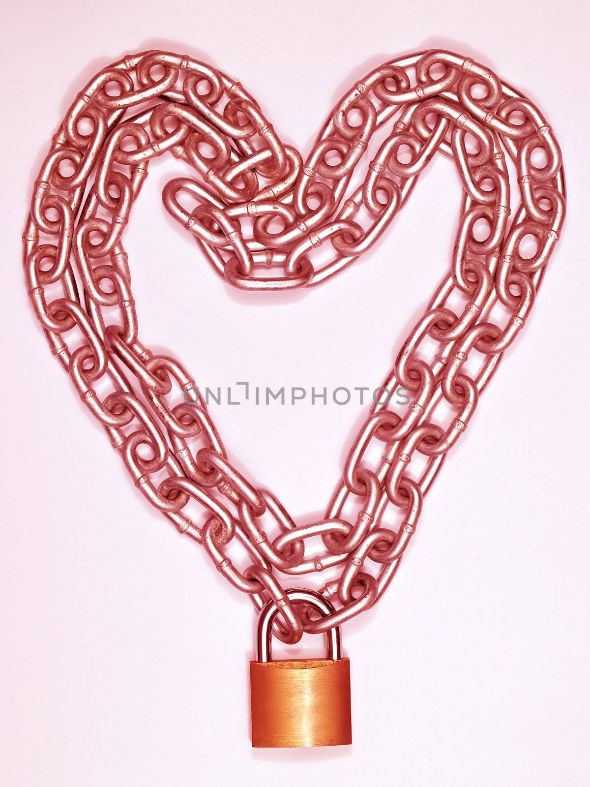 Heart shaped steal chain and gold lock. 