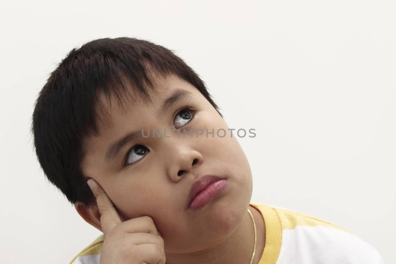 Nine  years old boy in white background