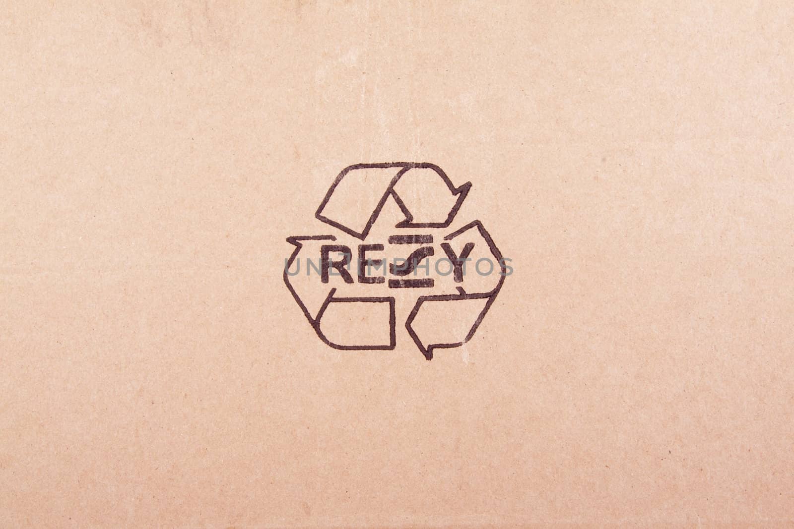 torn out piece of cardboard with recycle symbol by shutswis