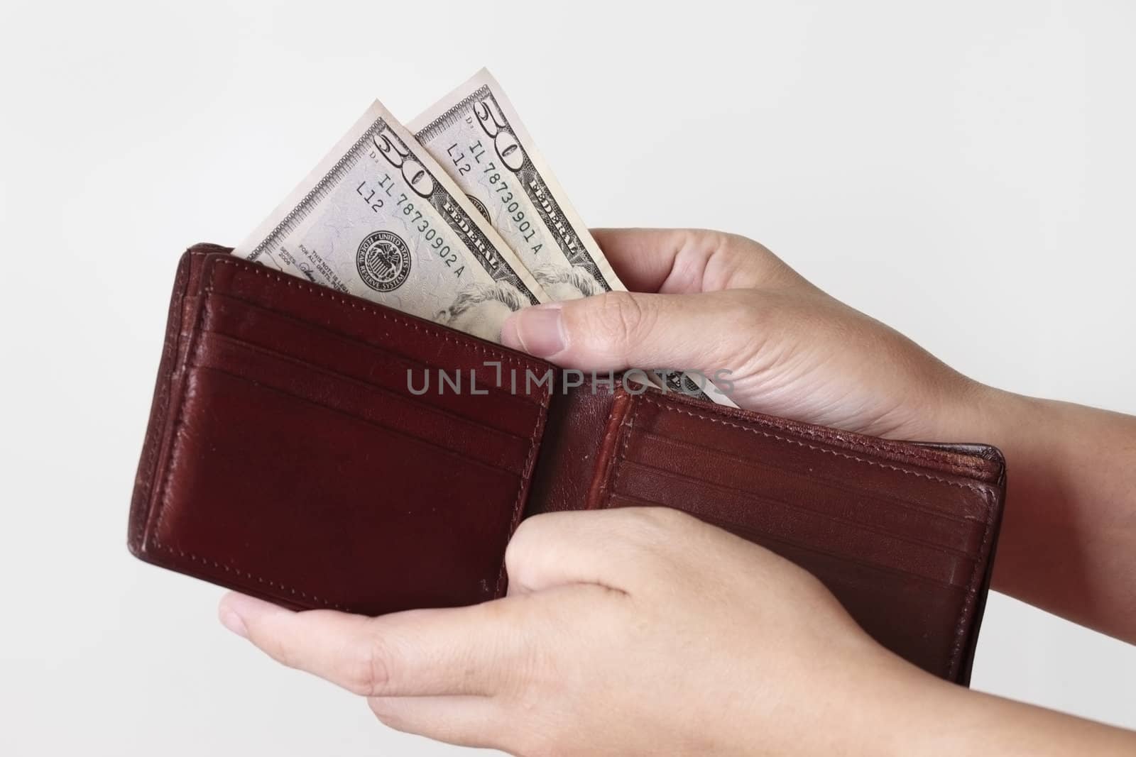 Fifty dollars in purse isolated on white background 
