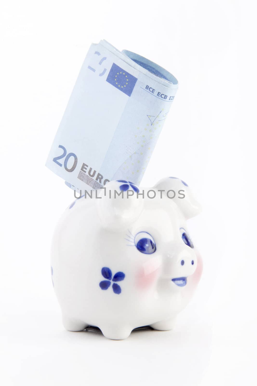 piggy bank with euro isolated on white
