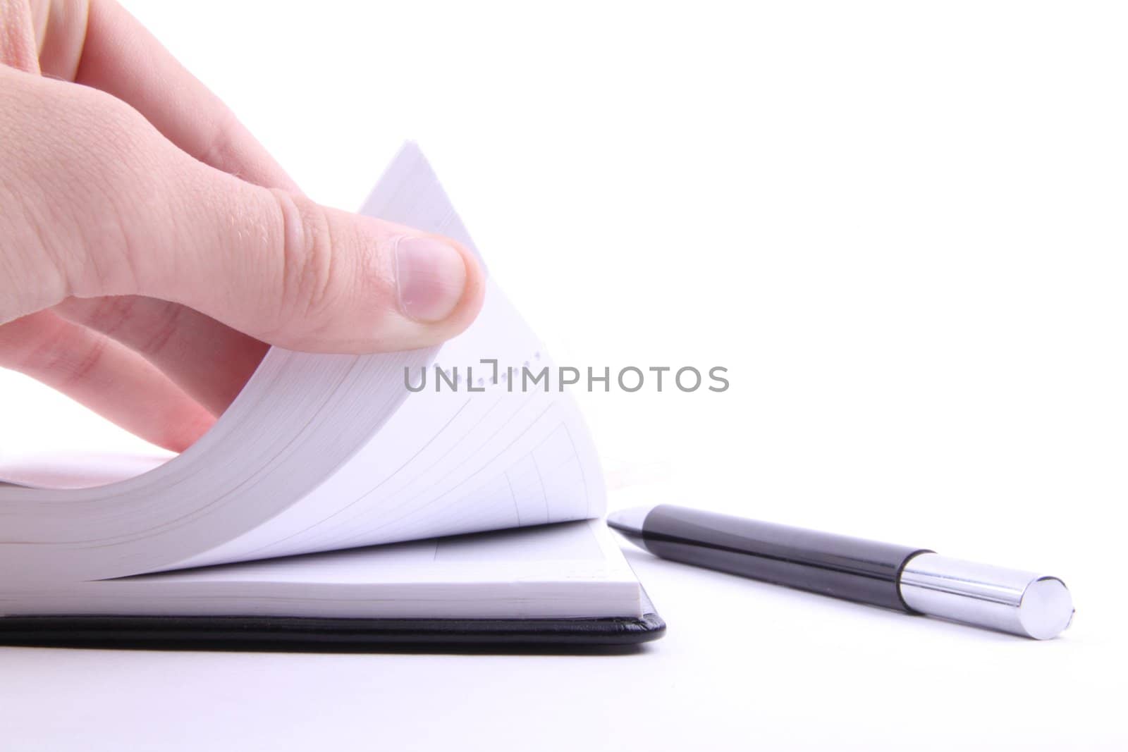 taking notes close-up on white background