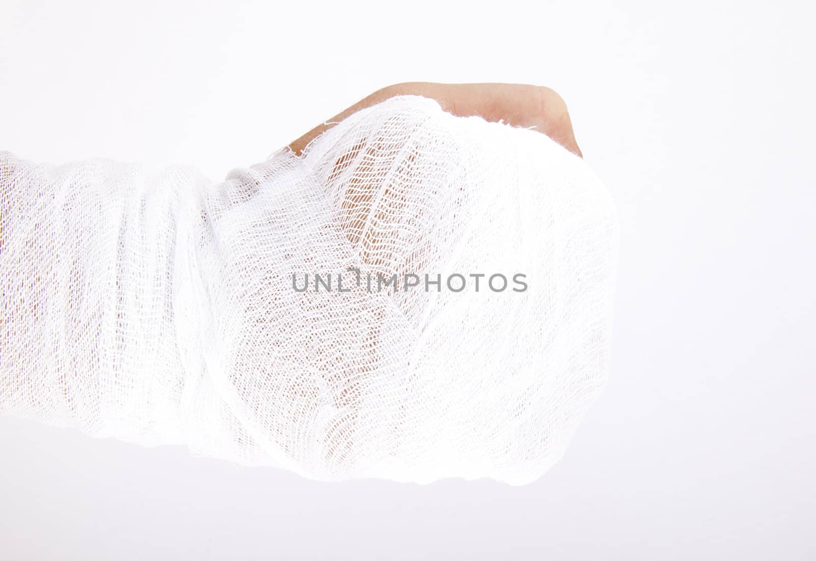 A horizontal image of a men's bandaged hand