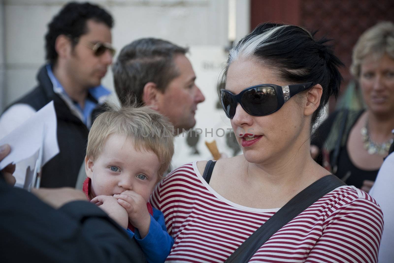 MOTHER AND LITTLE BOY, PARIS, FRANCE - SEPTEMBER 21, 2011: Crowd of tourists at Place du Tertre, Montmartre - Paris.
