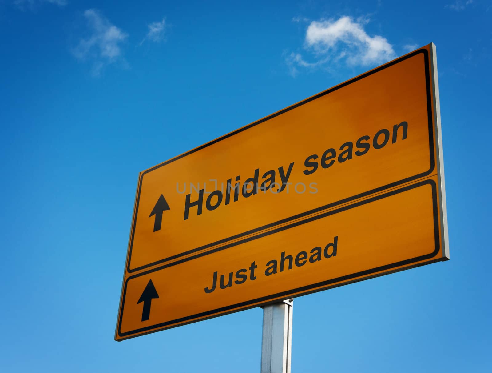 Holiday season just ahead road sign background sky.