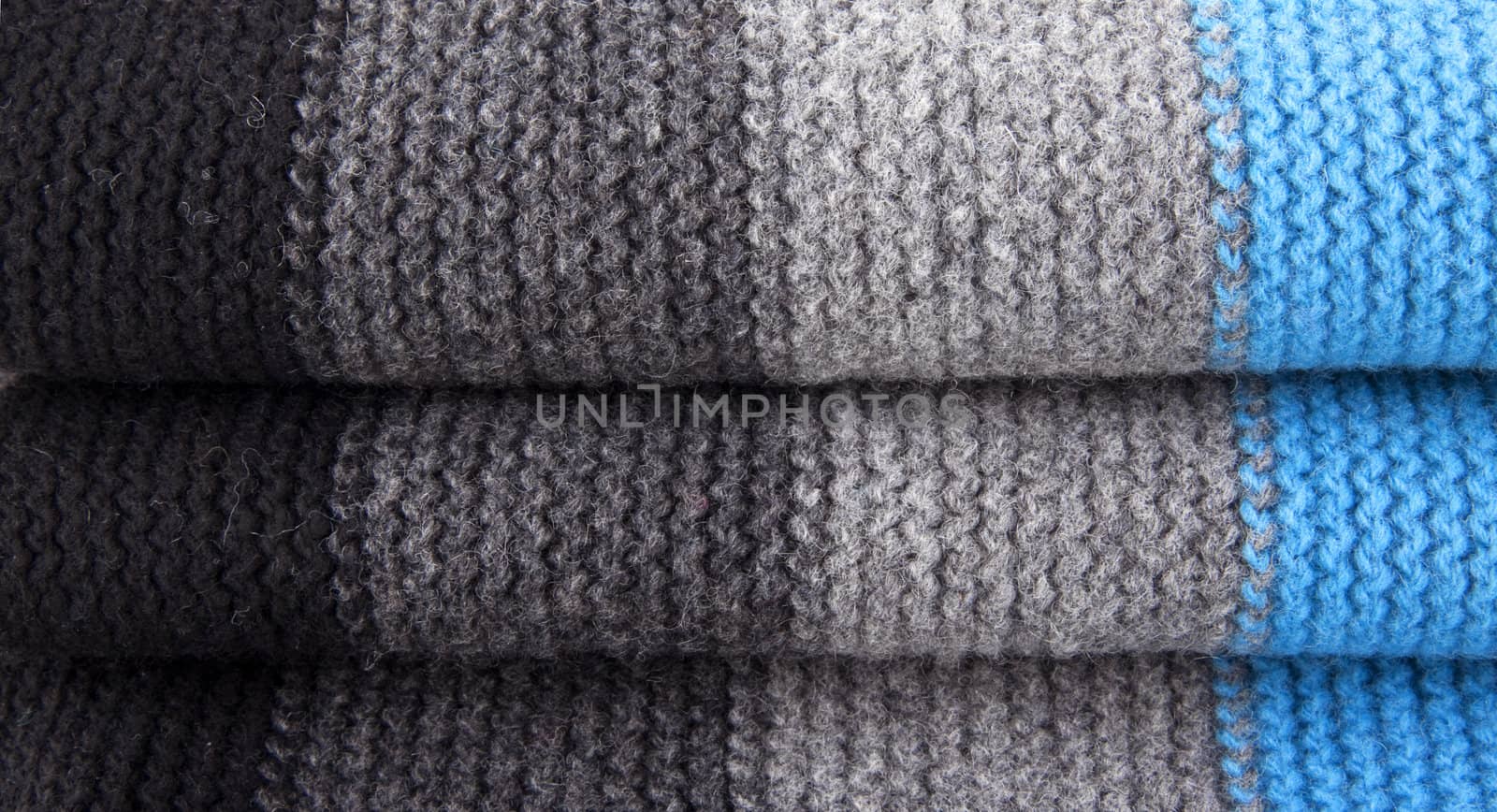 Close-up of striped woolen textile background or texture for site
