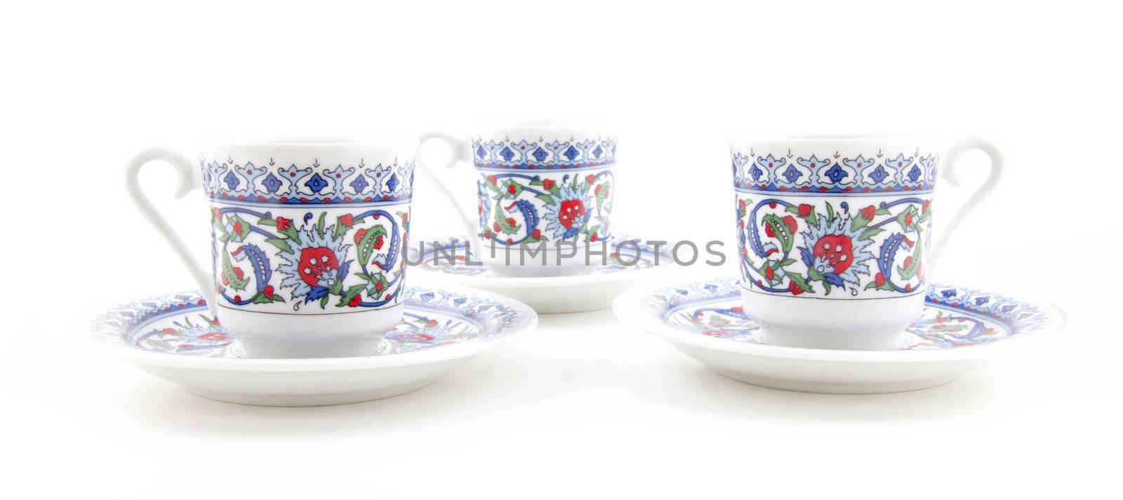 Ornamented teacups isolated on white background for site