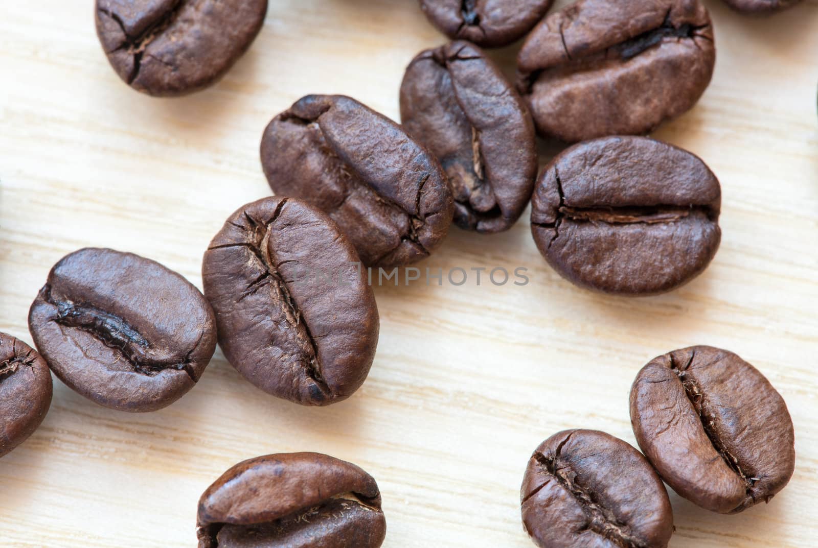 coffee beans on white wooden background by sfinks