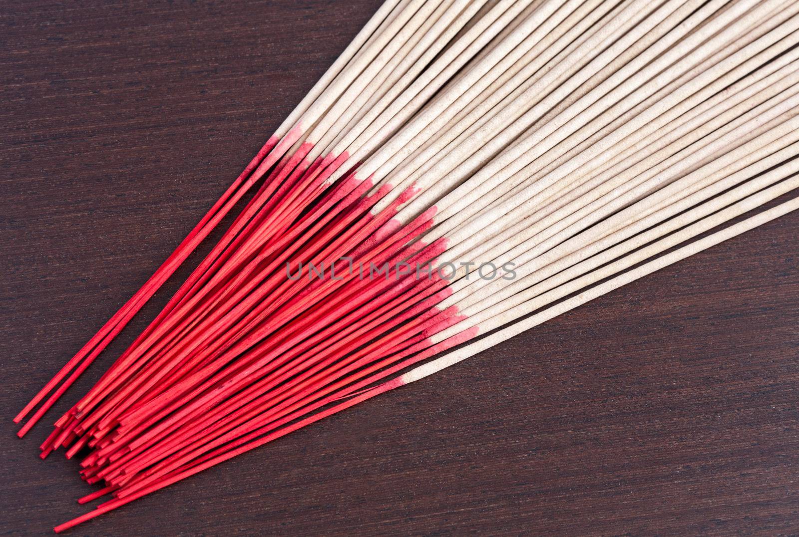Incense aromatic sticks on the wooden background by sfinks