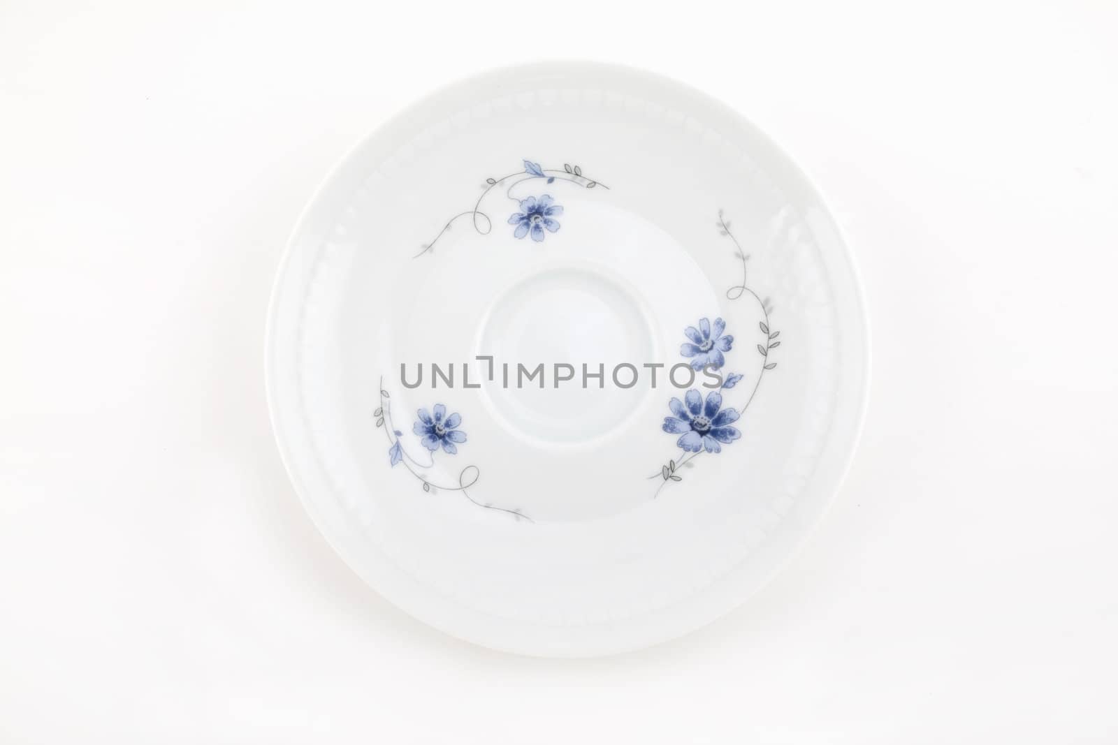 Ornamented plate on white isolated for site
