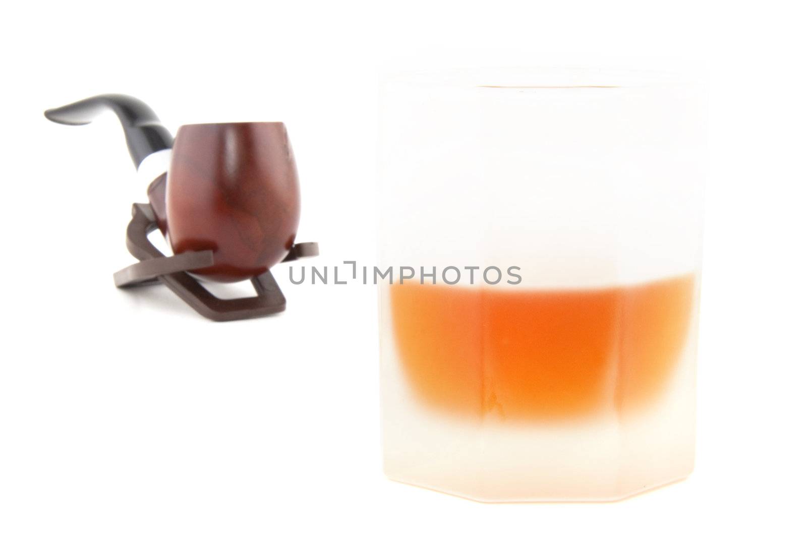 Wiskey wiyh tobacco pipe isolated on white