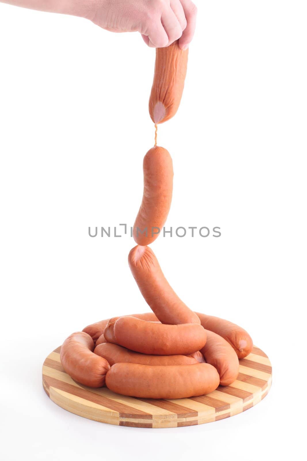 Sausages in hands on a white background