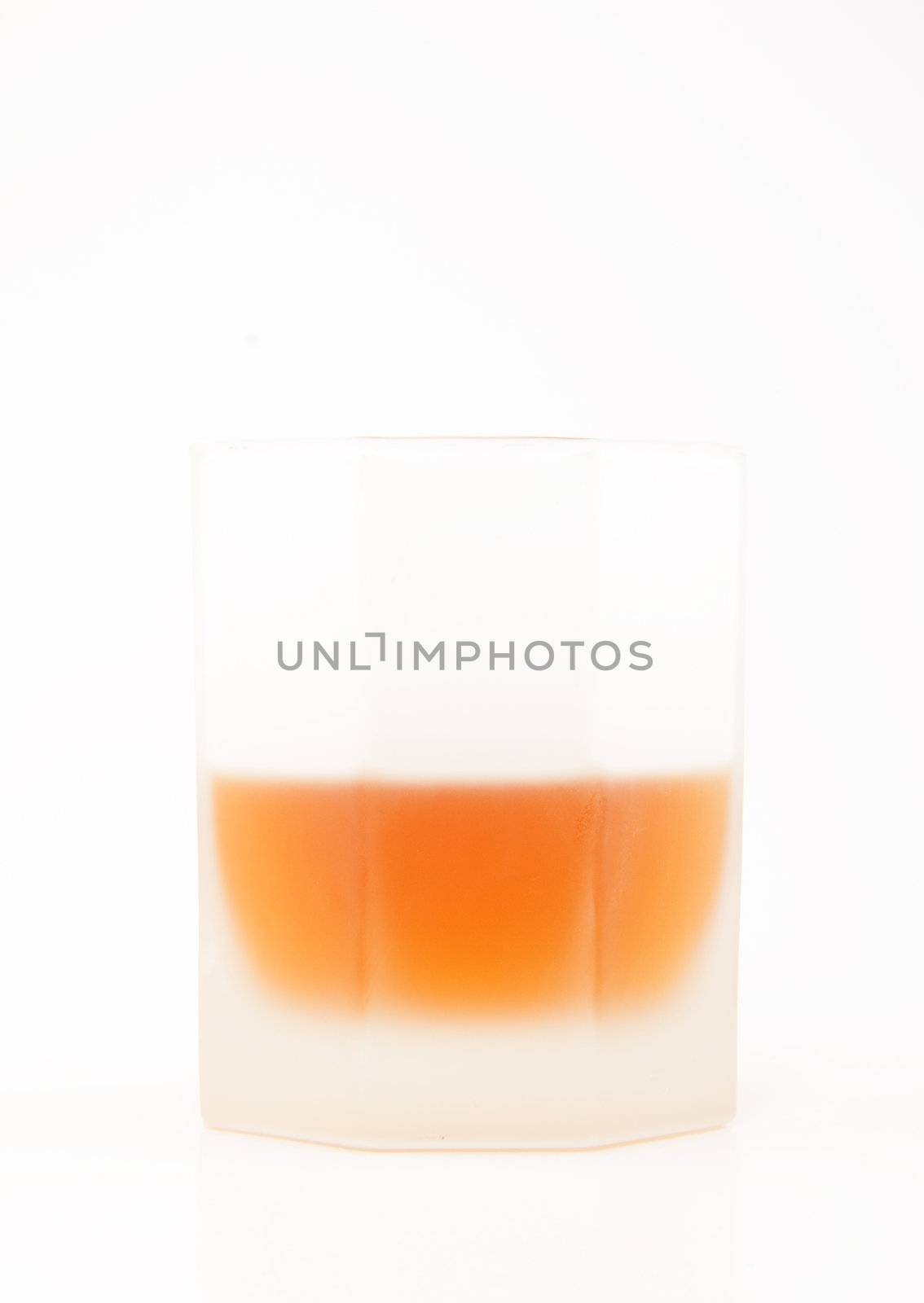 Glass of whiskey isolated on white background for site
