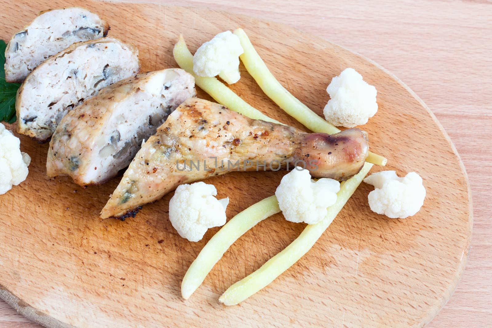 Grilled barbecue chicken quarters on a cutting board