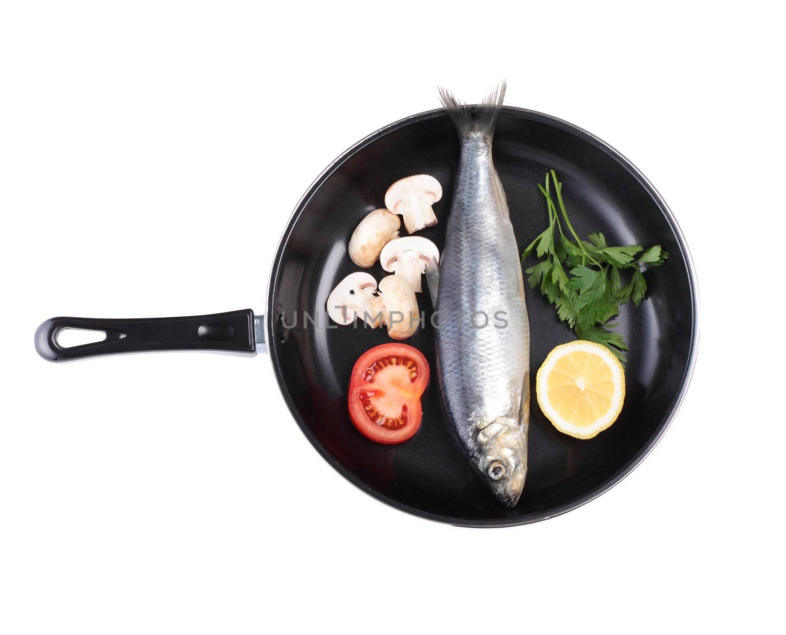 fish in pan with vegetables isolated on white