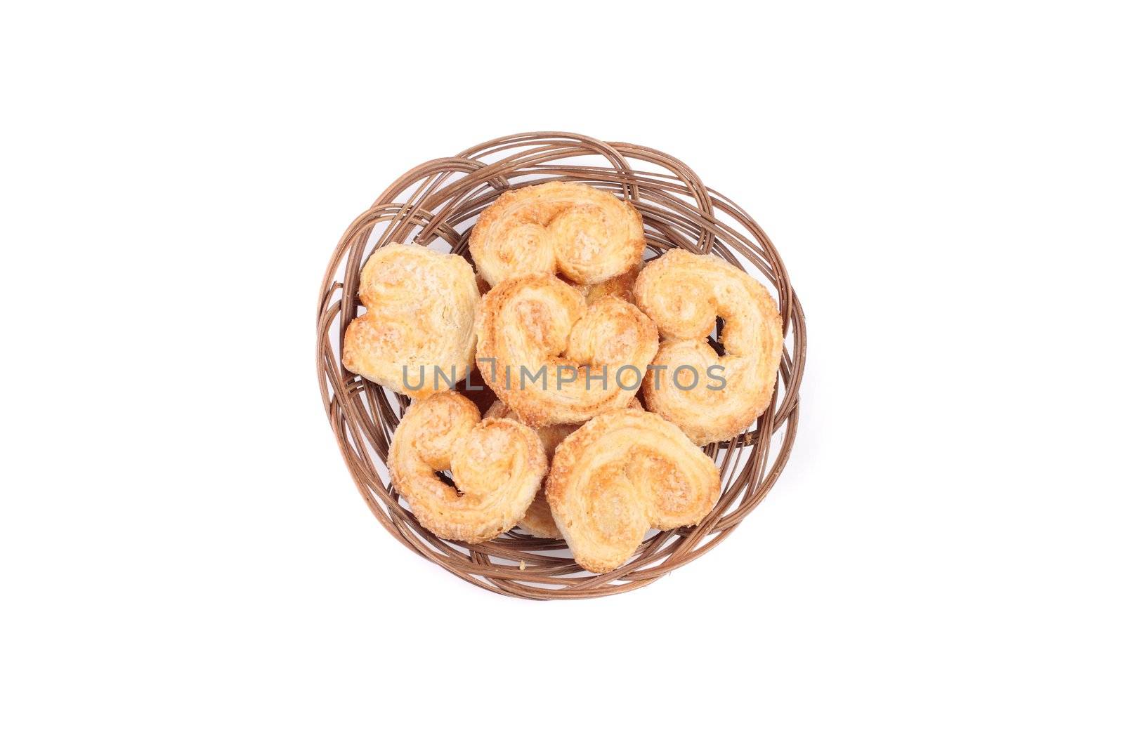 Dutch cookie in basket isolated on white