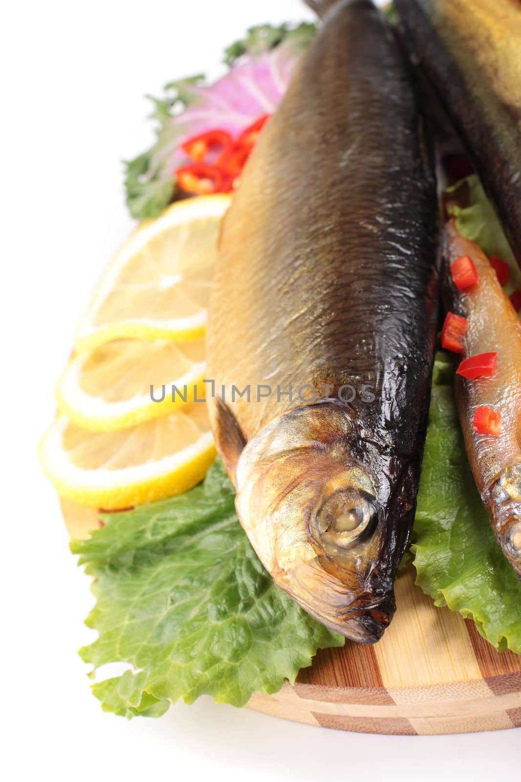 fish with lemon on plate isolaten on white