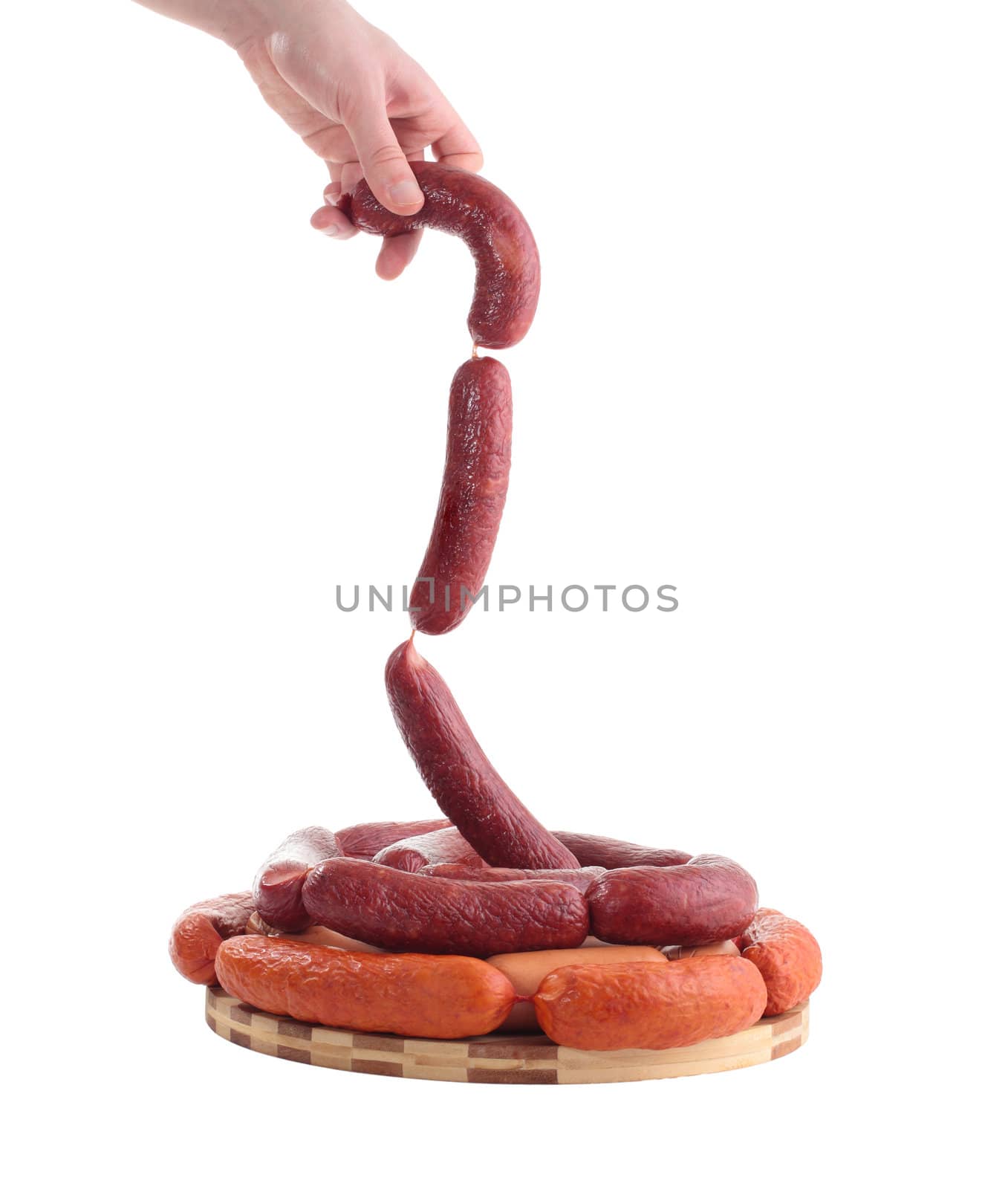 holding various sausages isolated on white background