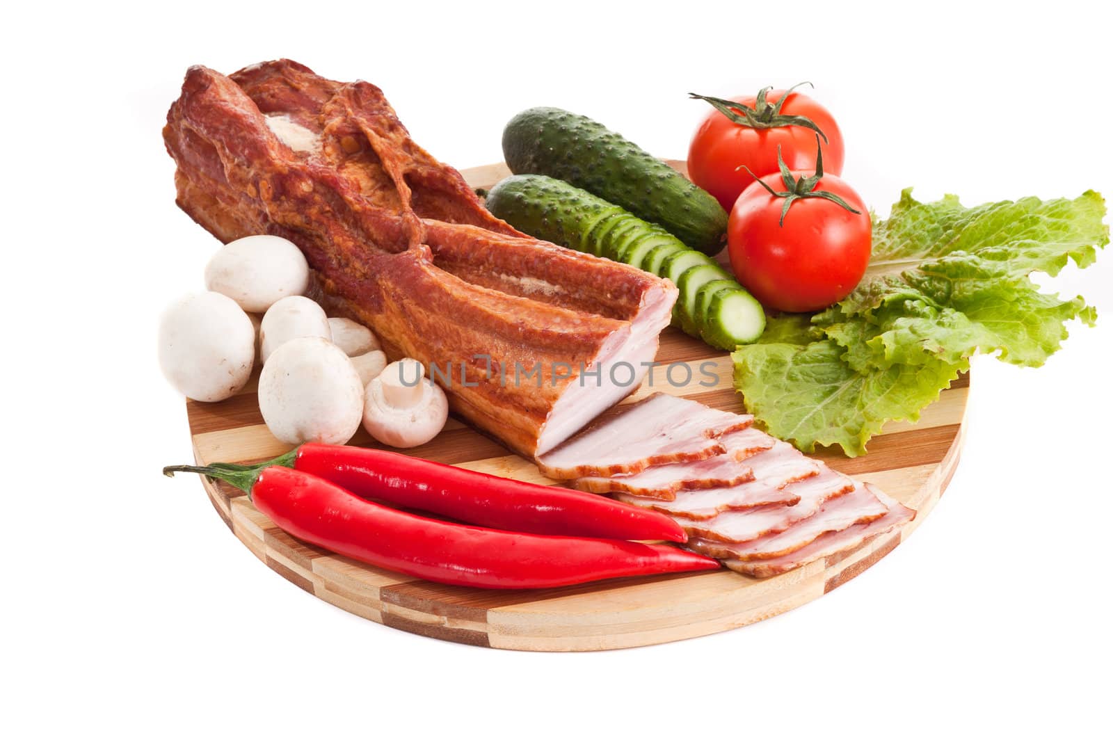 sausage on plate with vegetables isolated on white