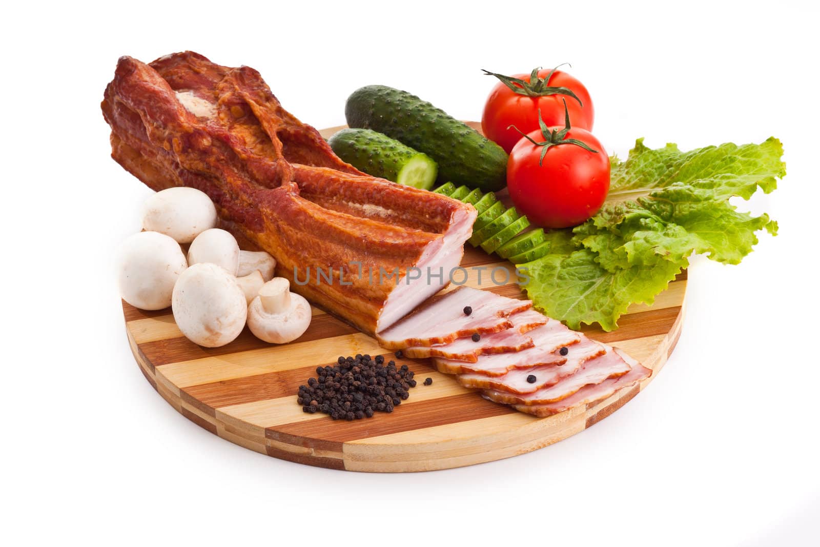 sausage on plate with vegetables isolated on white