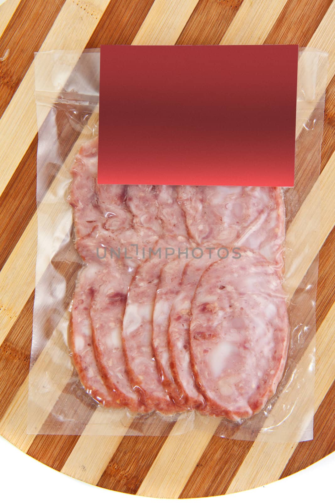 sliced meat packaged on plate isolated on white