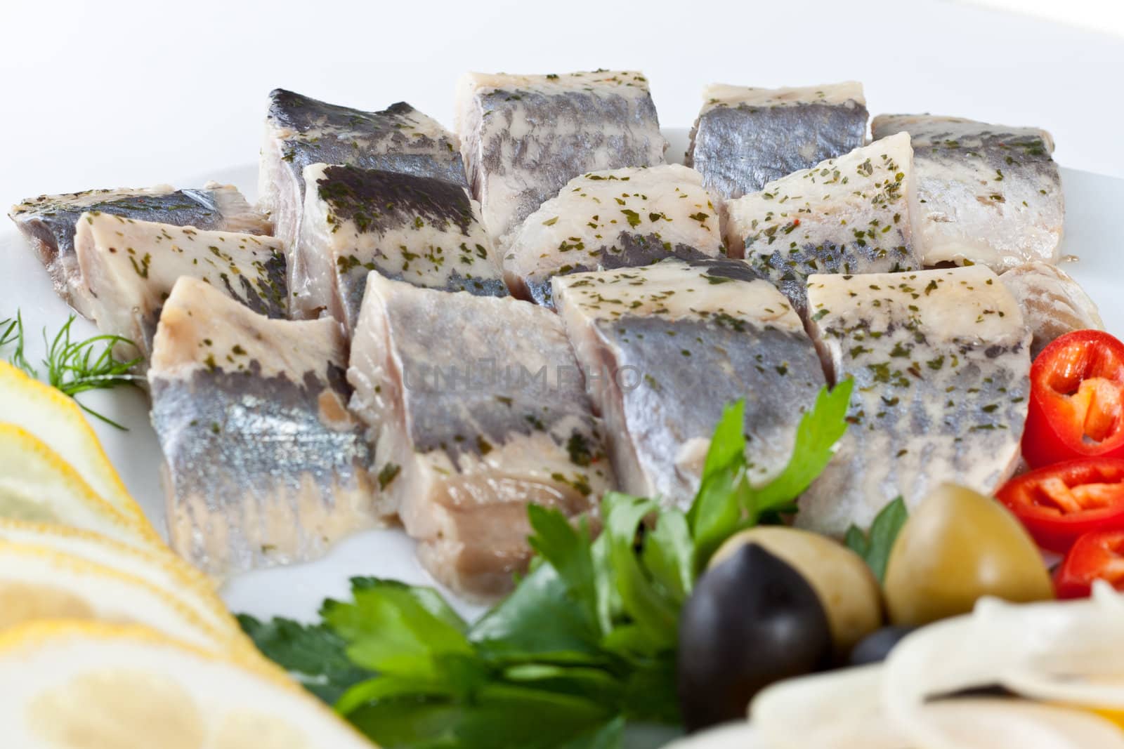 close up sliced fish with vegetables isolated