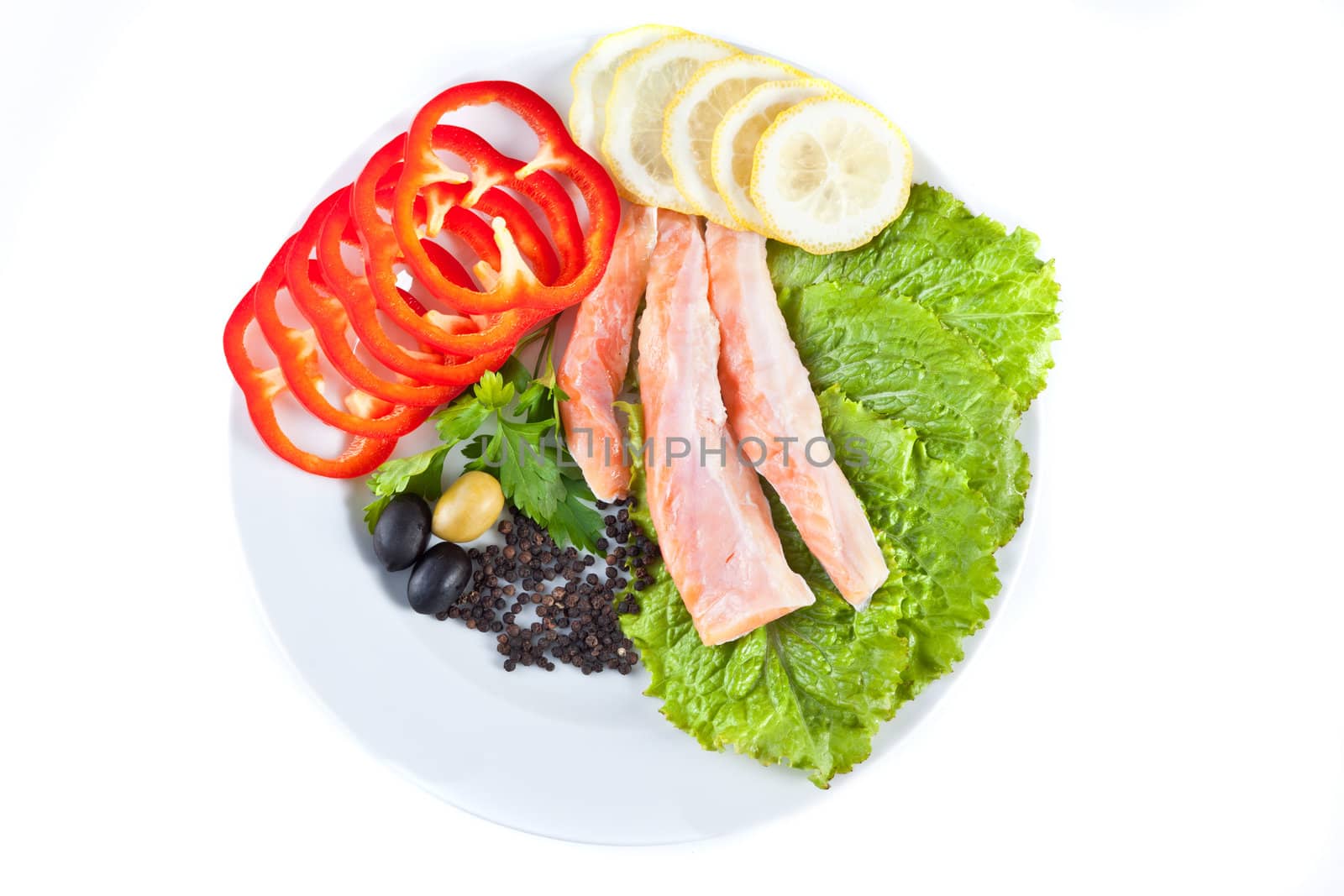 red fish in composition with vegetables isolated