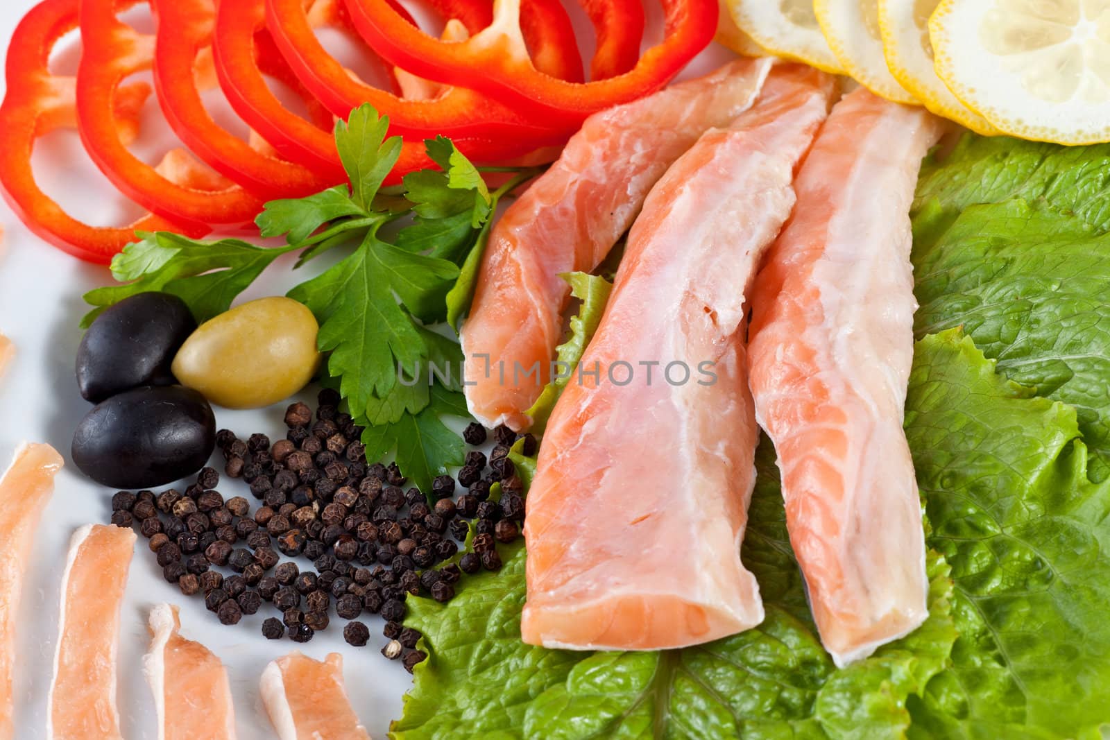 close up red fish with vegetables isolated