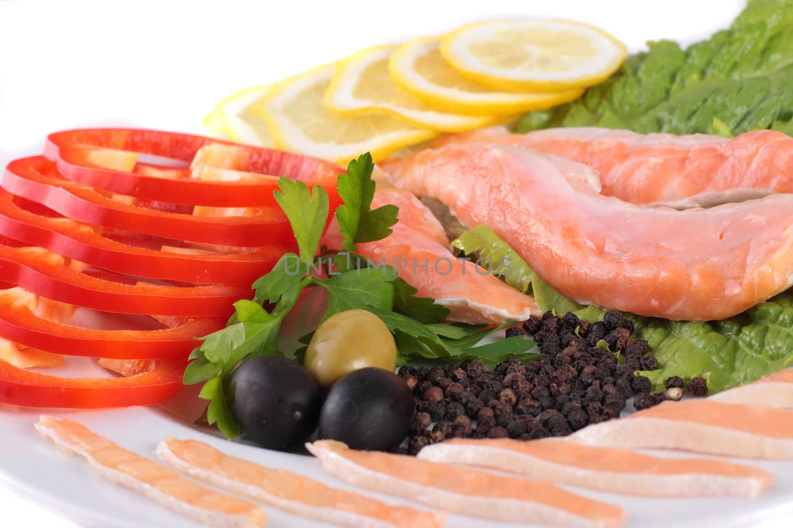 close up red fish with vegetables isolated