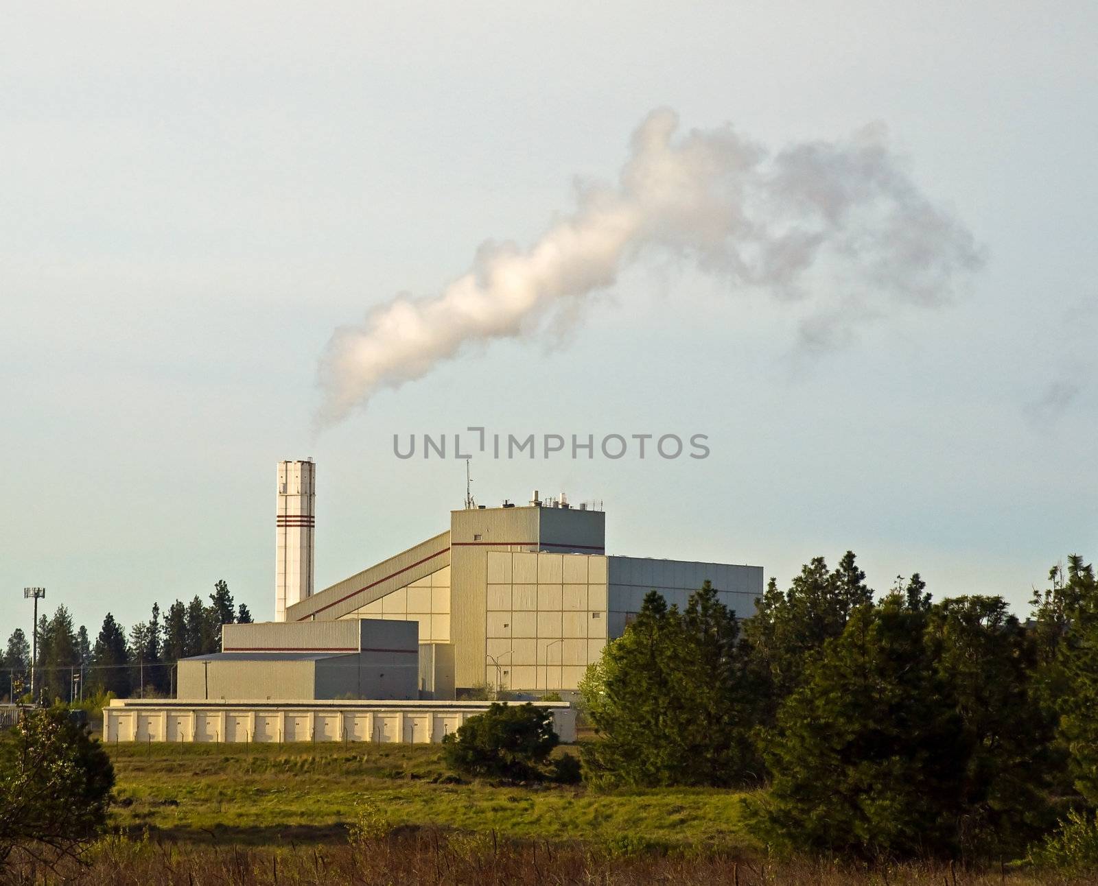 Waste to Energy Plant with Smoke Coming Out of a Smokestack 