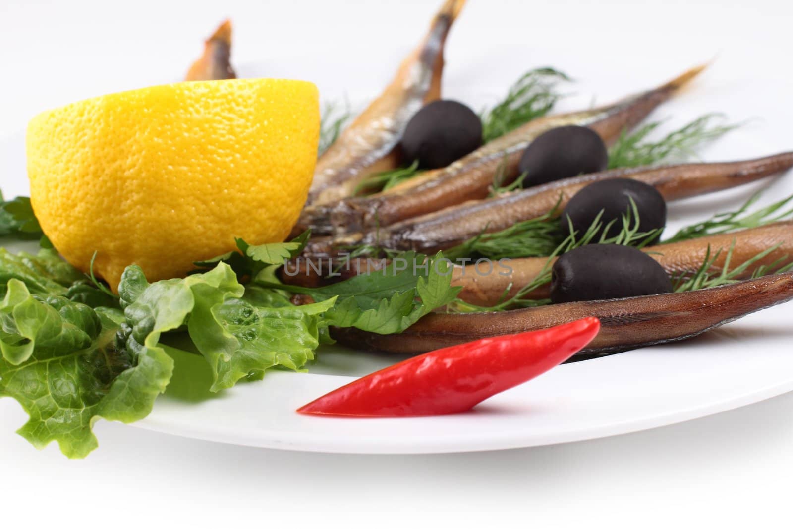 kipper fish on composition with vegetables by shutswis