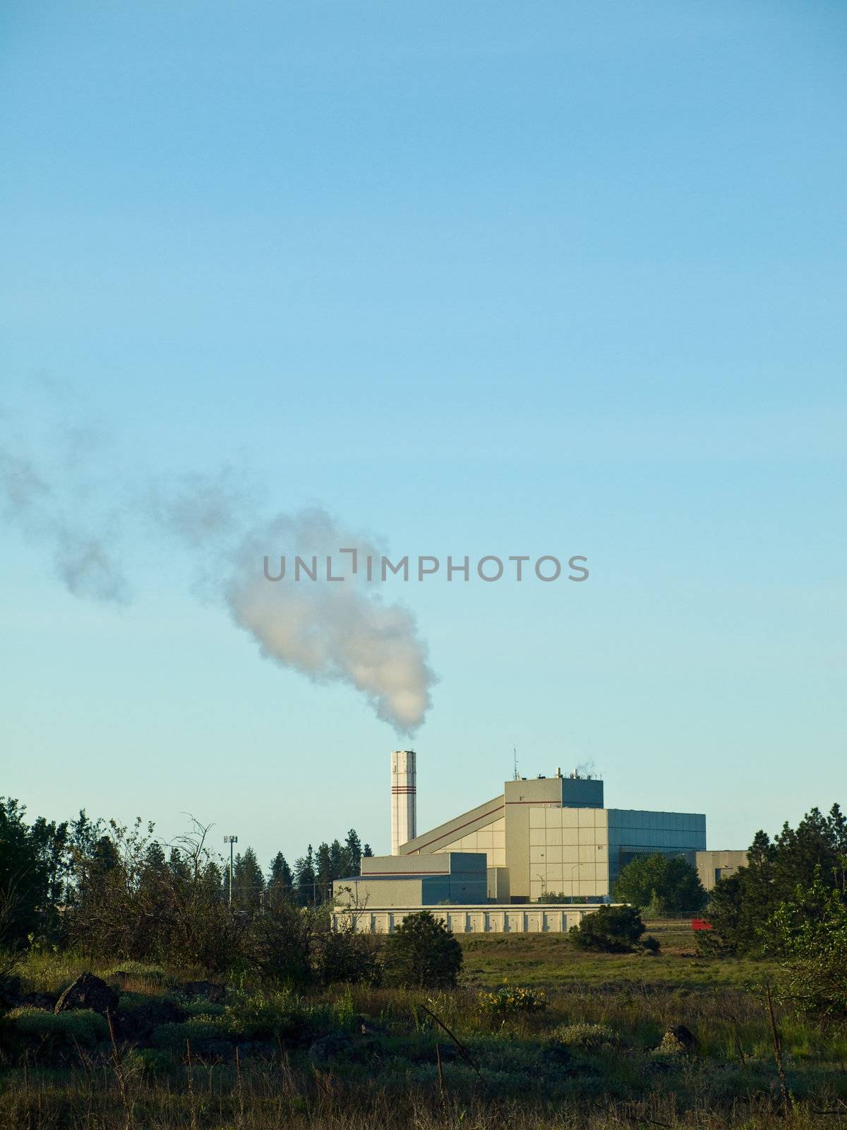 Waste to Energy Plant with Smoke Coming Out of a Smokestack 